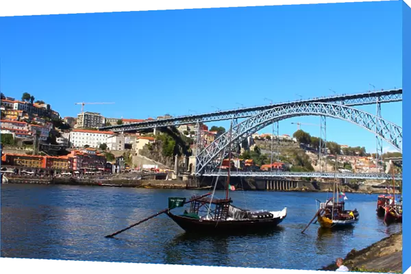 Dom LuAis I Bridge and a Rabelo boat in Porto