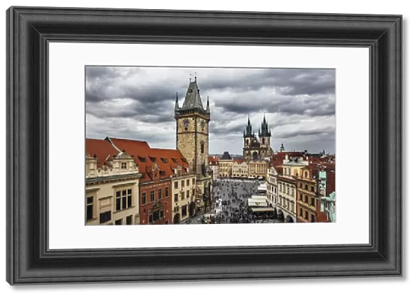 High angle view of Clock Tower, Old Town Square and Tyn Church on a clody gloomy day, Prague, Czech Republic