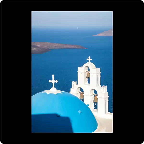Iconic blue cupola over the sea Santorini Greece