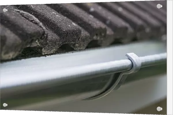 Guttering on the side of a house roof