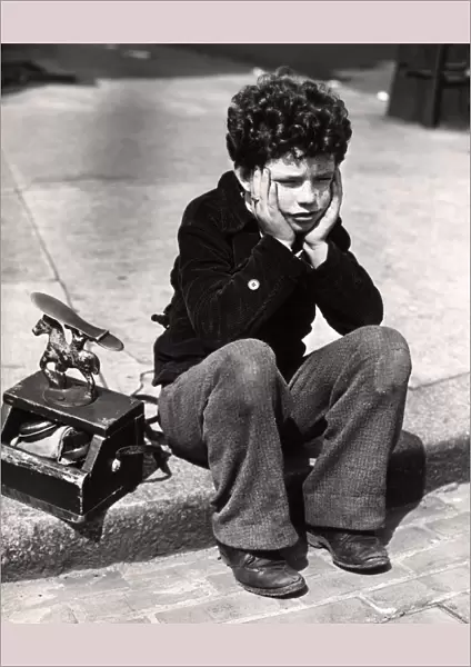 Sad Boy, Curly Hair Sitting On Curb Patched Trousers Shoeshine Kit Work Working Worker Shoe Shine Poor Poverty Depression Rrr Retro