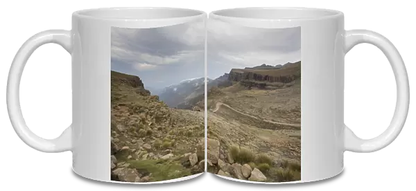 Landscape shot of 4x4 vehicles driving Sani Pass on the border of KwaZulu-Natal, South Africa and Thaba-Tseka, Lesotho