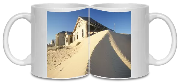 Abandoned Houses with Sand Dune in Foreground