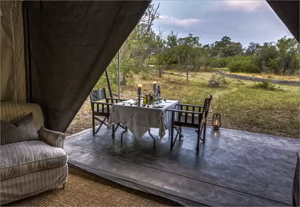 Dining outside of luxury tent, Machaba Camp, Okavango Delta, Botswana