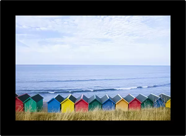 Colourful beach huts along the seafront