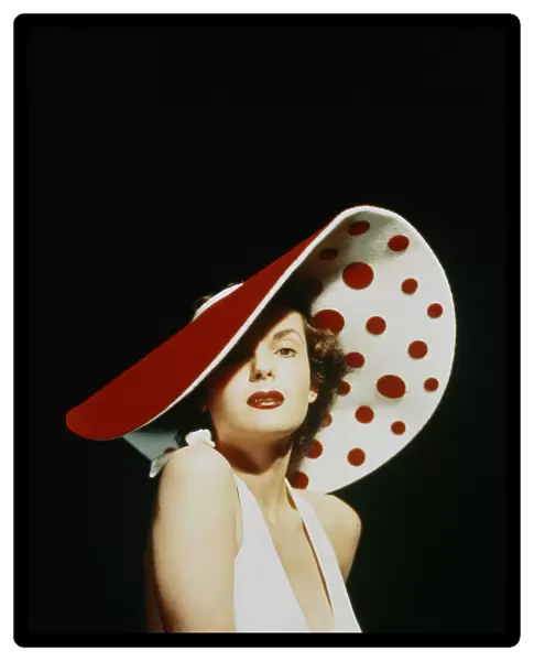 GLAMOROUS WOMAN IN A LARGE RED AND WHITE HAT