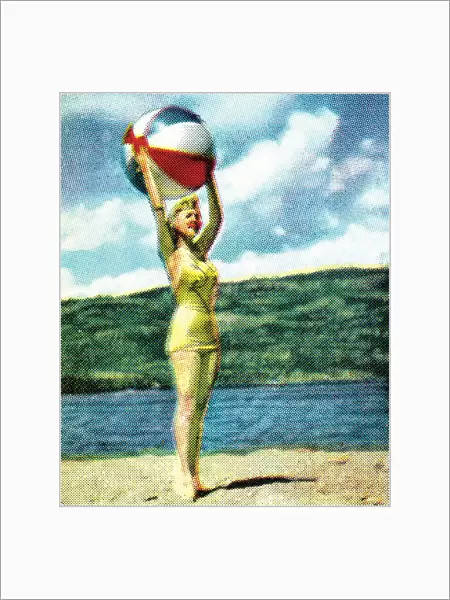 Girl on beach with beach ball
