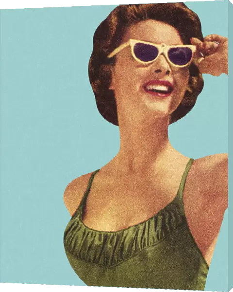 Woman Wearing Sunglasses and Green Swimsuit