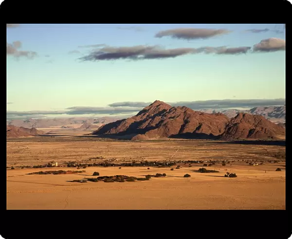 View from Elim Dune onto grass steppe, Sesriem Camp and Tsaris Mountains, Namib Desert
