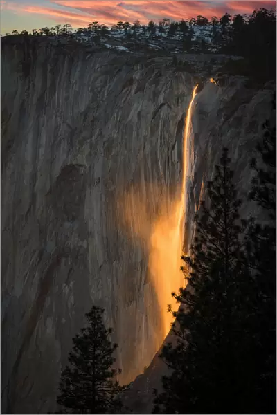 Sunset play with the reflection on waterfall at Yosemite National Park