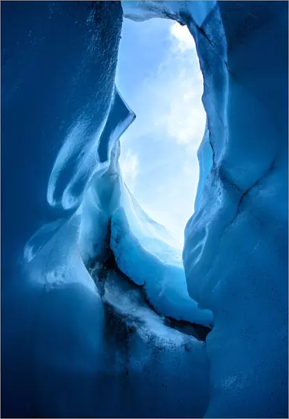 Ice Hole. looking up from an ice cave in Alaska