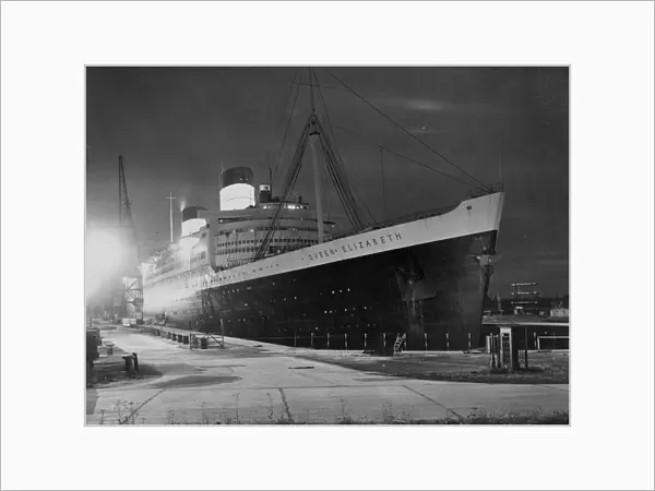 The Queen Elizabeth in dry dock. After hold-up at 12 hours due to unfavourable weather