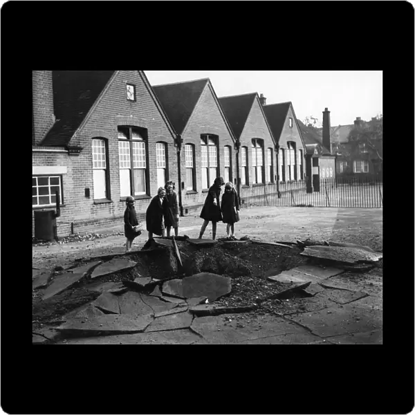 Children inspecting the damage at their school in Sidcup, Kent in WWII
