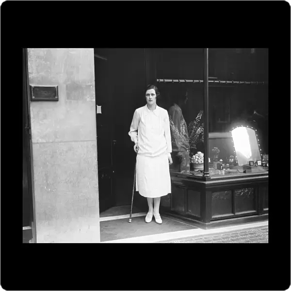 Society beauty opens a shop Mrs Dudley Coats standing in the door way of 10, Davies Street