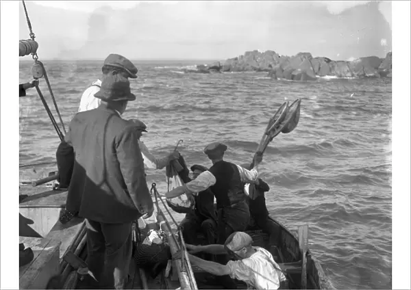 Men in the Channel Islands out fishing for ormers ( abalone - shellfish ) 8 October 1920