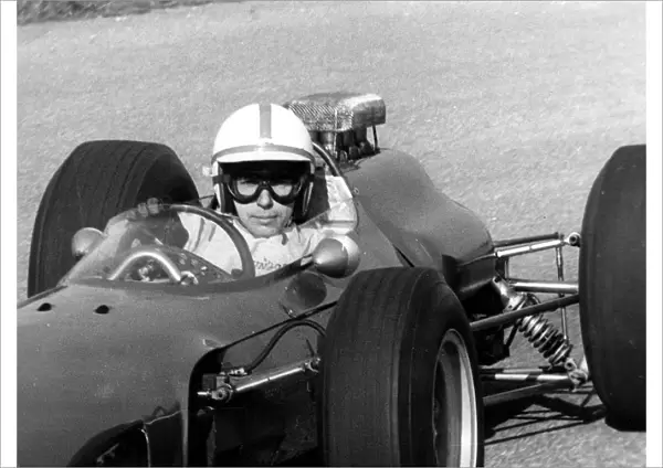 After his accident world famous auto racer John Surtees has stepped into a racing