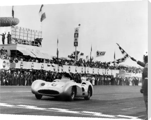 Argentines car ace Juan Manuel Fangio in a Mercedes Bez is flagged in winner of