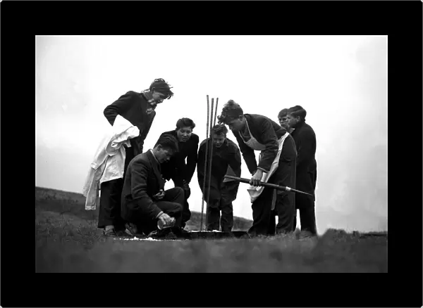 Boys on the Sussex Downs preparing to launch their rocket made from a meccano set. 1959