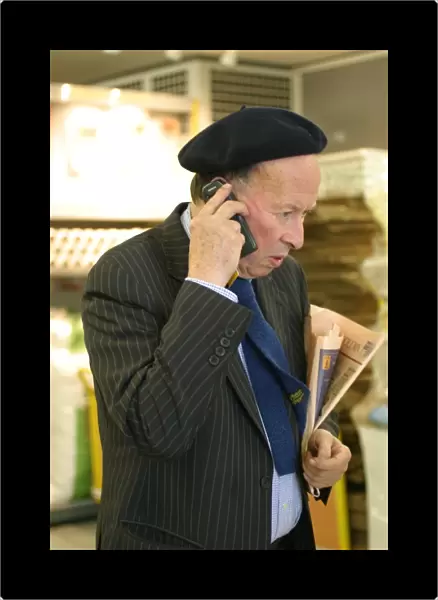 Business man talking on a mobile phone ?TopFoto