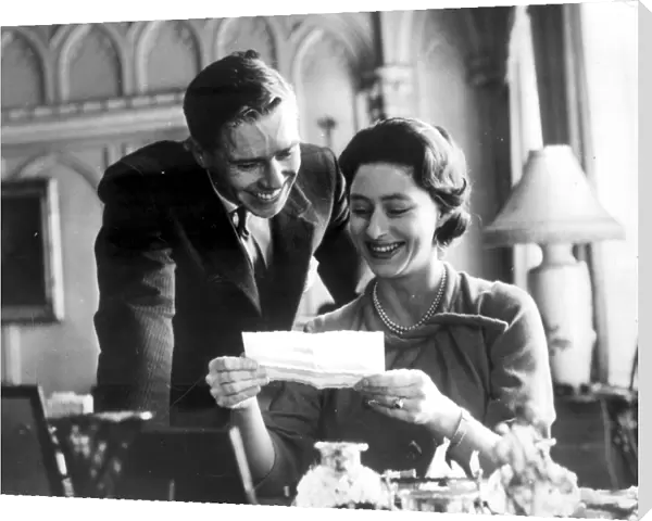 Engagement picture of Princess Margaret and Anthony Armstrong Jones reading a telegram