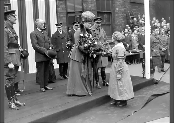 Royal Visit to Lincoln. Queen recieving a bouquet from a Munition Girl. (Messrs Robey