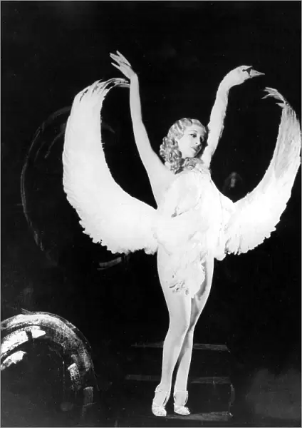 Sally Rand of Fan Dance fame is shown in one of the positions in her new dance which
