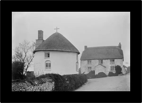 Thatched round house with a cross, Veryan Green, Veryan, Cornwall. 1910