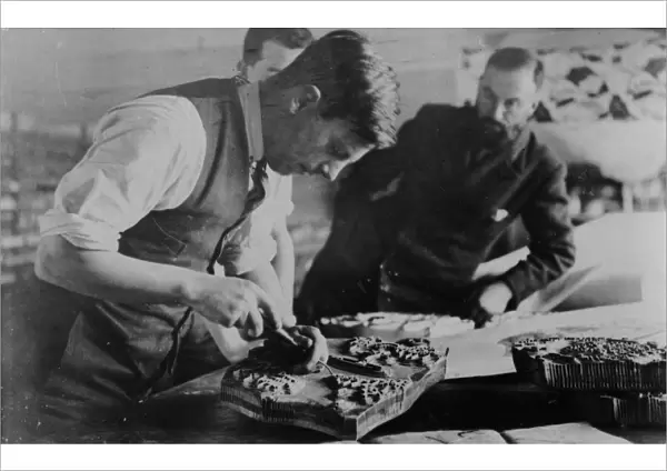 Carving a printing block at Crysede Island Works, St Ives, Cornwall. Probably 1930s