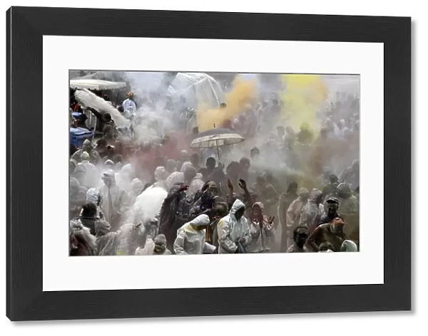 People participate in the flour war on the streets of Galaxidi, some 250