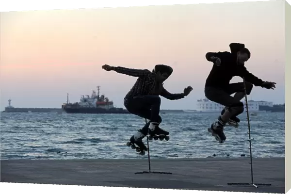Two Skaters Jump on the Sevastopol Embankment