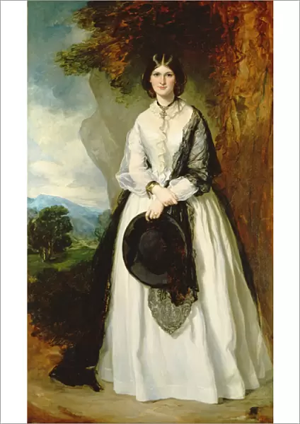 Young woman in white dress against a landscape