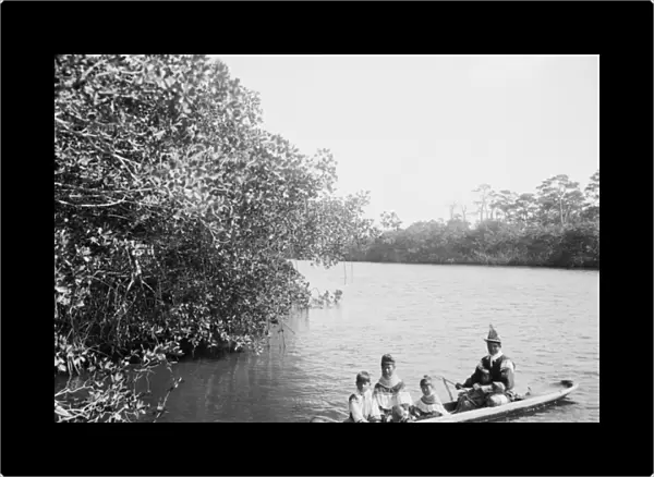 Seminole Indian and family dugout canoe, Miami, Florida, c. 1910-20 (b  /  w photo)