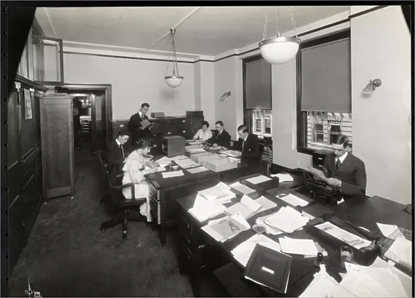 Men and women working in the export and filing office of R. Martens & Co. Inc