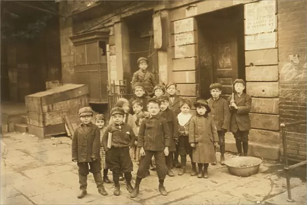 Children outside motion picture theatre at night, 1910 (b  /  w photo)