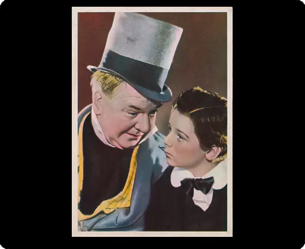 Hollywood actors W C Fields and Freddie Bartholomew in a scene from the film David Copperfield. (coloured photo)
