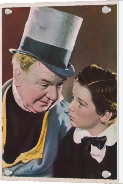 Hollywood actors W C Fields and Freddie Bartholomew in a scene from the film David Copperfield. (coloured photo)