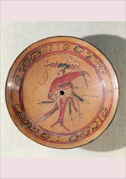 Large tripodal dish depicting an actor or dancer, 600-950 (painted terracotta)