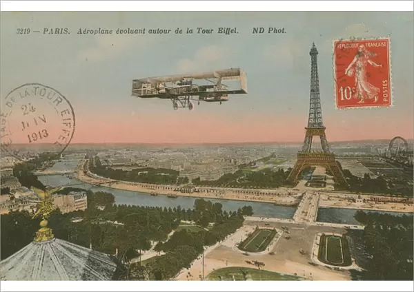 Postcard of an aeroplane circling around the Eiffel Tower, sent in 1913 (hand-coloured photo)