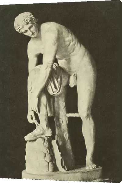 Hermes Fastening his Sandal, ancient Roman sculpture in the collection of the Glyptothek, Munich, Germany (b  /  w photo)