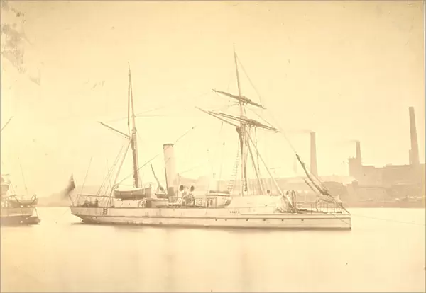 The starboard side of the gunboat Delta moored in the River Tyne, c