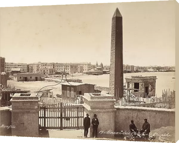 Alexandria, Egypt: the Obelisk of Cleopatra, with four men posing for the photograph