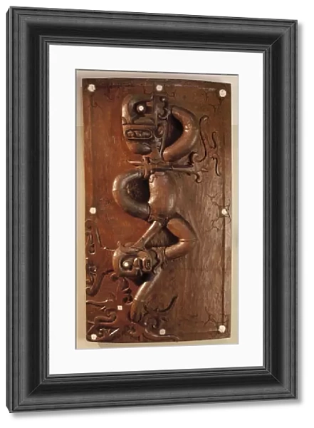 Carved door depicting the victory of the protective spirit over evil in Sarawak, Malaysia (wood)
