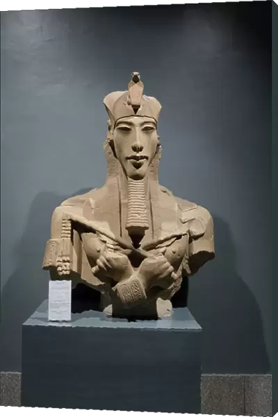 King Akhenaton wearing the double crown and holding Heka and Wast, 1365-1360, from Karnak (sandstone)