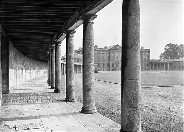 Looking through the colonnade to the entrance facade, Burley-on-the-Hill, Rutland, from The Country Houses of Sir John Vanbrugh by Jeremy Musson, published 2008 (b / w photo)