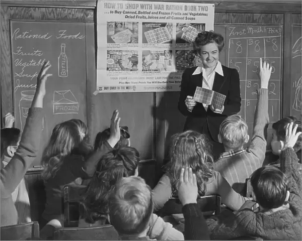 A 6th grade teacher instructs her elementary students. circa February 1943