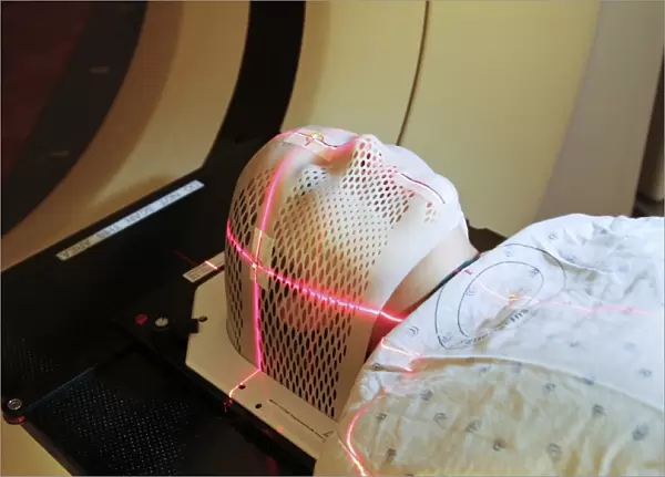 Lasers used to position a patient wearing a short face mask in a computed tomography