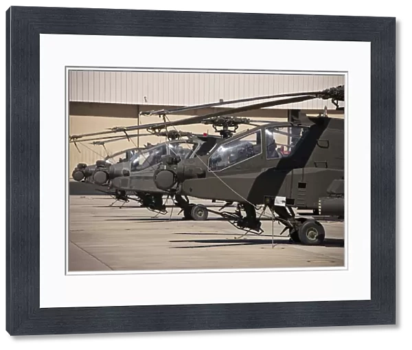 A row of AH-64D Apache Longbow helicopters