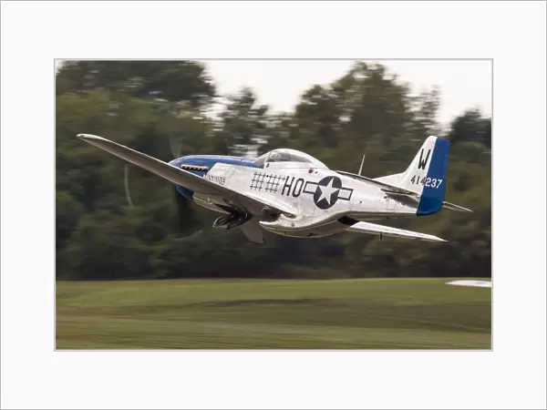 A P-51 Mustang takes off from Waukegan, Illinois