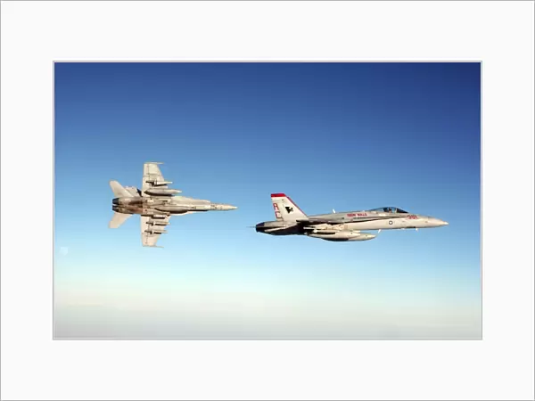 A pair of F  /  A-18C Hornets fly over Iraq