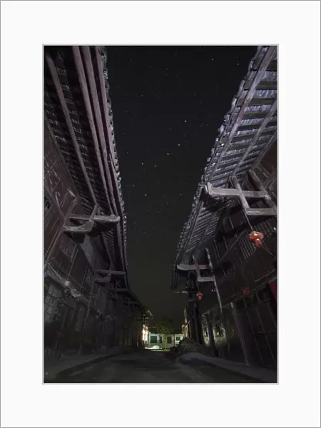 The Big Dipper seen through the alley way of a street in China